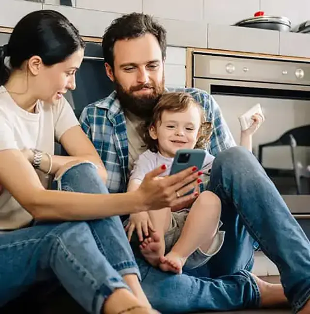 family sitting in a kitchen