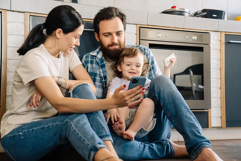family sitting in a kitchen